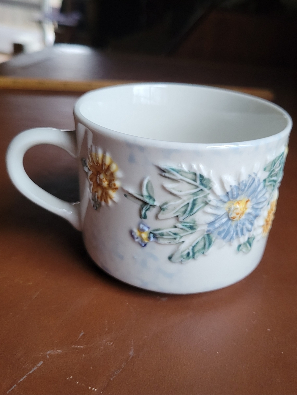 Tabletops Unlimited Daisy Patch Coffee Mug Embossed Floral Ceramic Cup